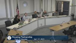 Thumbnail of the meeting video shows the entire housing partnership board sitting behind the meeting desk.