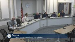 Thumbnail of meeting video shows the full board and one staff person in the meeting room.