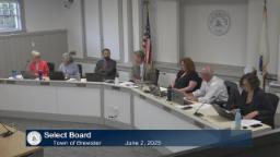 Thumbnail of meeting video is a wide shot of the entire board and two staff