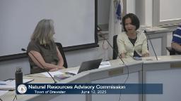 Thumbnail of meeting video shows two committee members in the meeting room looking toward eachother
