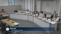 Thumbnail of meeting video shows wide shot of the entire committee and a staff person