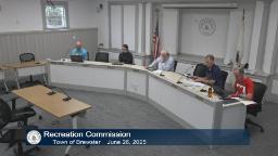 Thumbnail of meeting video shows a wide shot of the committee and one staff person