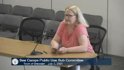 Thumbnail of meeting video is of one person in a peach colored tshirt and blonde hair sitting behind the presenter's table in Rm A.