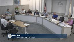 Thumbnail of meeting video shows a wide shot of the committee with two staff and a person sitting at the presenter's table in Rm A.