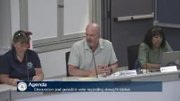 Thumbnail of meeting video shows two town staff and a commission member sitting in meeting room a.