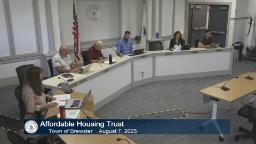 Wideshot of meeting video shows the entire trust and a staff person.