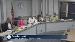 wide shot of the entire board of health there are 5 people sitting in room a