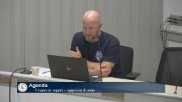 Recreation director is sitting at the end of the table in meeting room a for the recreation commission meeting