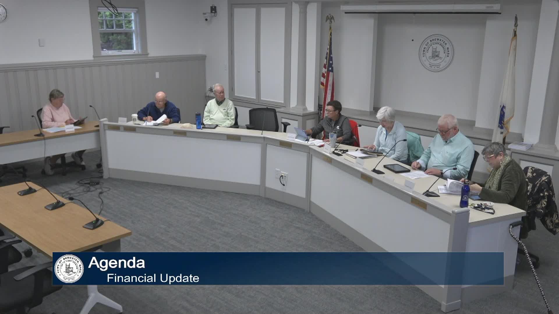 Wideshot of committee members sitting in their meeting in meeting room A.